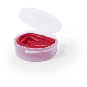A red drinking straw inside a clear container with a lid. The container is pinkish in colour.