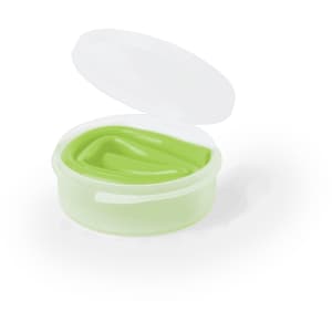 A small round container with a transparent lid, holding a flexible green straw.