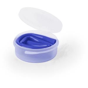 A round container with a transparent lid, holding a smooth, deep blue substance. The container features a logo.
