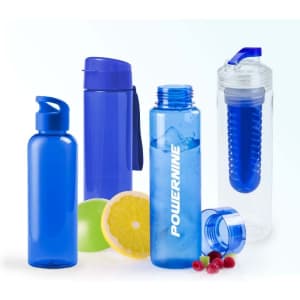 A drink bottle collection featuring various shades of blue, with one clear bottle for infusing flavours, alongside citrus fruits.