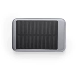 A silver rectangular power bank with a black solar panel surface and a logo on the front.