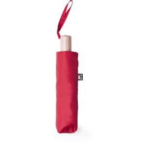 A red umbrella with a wooden handle, featuring a matching protective sleeve and a logo.