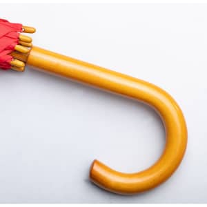 A red umbrella with a wooden handle and curved design, featuring a branding logo.