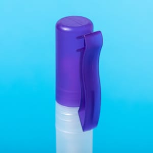 A clear hand sanitiser bottle with a purple lid and clip, set against a light blue background.