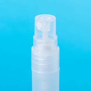 A clear spray bottle with a white nozzle on a blue background, designed for hand sanitiser.