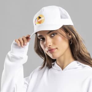 A white cap with a mesh back, featuring a logo on the front, worn by a model with long hair.