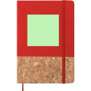 A red notepad with a cork bottom and a blank green window on the front, featuring a matching red elastic band.