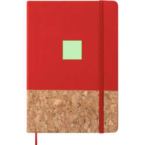 A red notepad with a cork bottom and a small green square, featuring an elastic band closure and a logo.