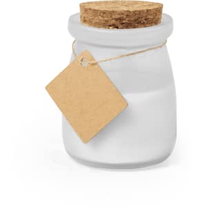 A frosted glass candle jar with a cork lid and a blank kraft tag attached. The candle appears white.