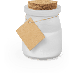 A white aromatic candle in a glass jar with a cork lid, featuring a simple brown tag attached.