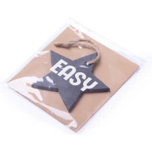 A star-shaped decoration in black with a jute string, packaged on a brown backing card. It features the word "EASY."