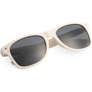 A pair of cream-coloured sunglasses with dark lenses, featuring a logo on the side.