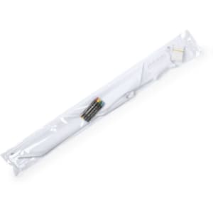 A white kite packaged in clear plastic, featuring a handle and multicoloured string.