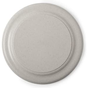 A beige frisbee with a smooth, rounded design, featuring a subtle branding logo on the surface.