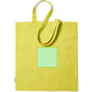 A bright yellow tote bag with long handles and a square area in the centre. It features a logo.