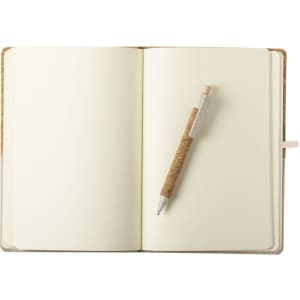 A notepad with blank pages and a wooden pen resting on it, featuring a light brown cover.
