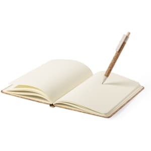 A notebook with a cork cover and blank pages, accompanied by a cork-capped pen.