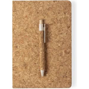 A cork notebook in a natural finish with a matching cork pen resting on top. Features a simplistic design and a logo.