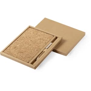 A notebook set with a cork cover, presented in a brown cardboard box, featuring a matching pen in the interior.