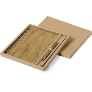 A bamboo notebook with a spiral binding and a pen, packaged in a brown cardboard box.