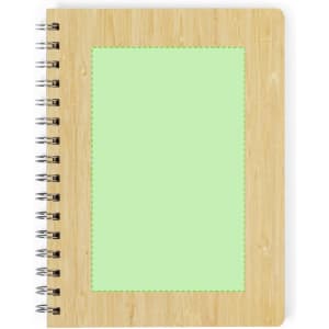 A spiral-bound notebook with a bamboo cover and a light green blank space on the front. It features a logo.