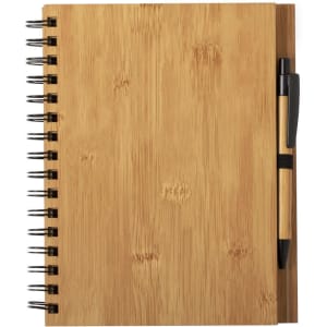 A bamboo notebook with a spiral binding and a matching pen attached, featuring a natural wood finish.