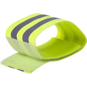 A reflective armband in bright yellow with dark stripes, featuring a velcro closure.