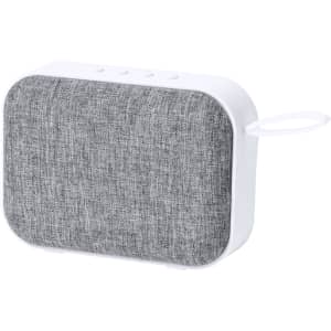 A portable speaker featuring a white body and grey fabric grille, with a loop for carrying.