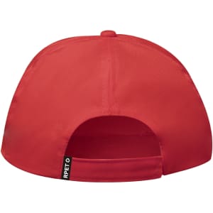 A red cap featuring a branded tag at the back and a curved brim.