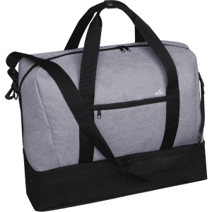 A grey duffle bag with black accents, featuring dual handles and a detachable shoulder strap. It has a logo on the front.