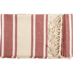 A folded towel pareo with red and cream stripes, featuring decorative tassels on one edge, and a logo present.