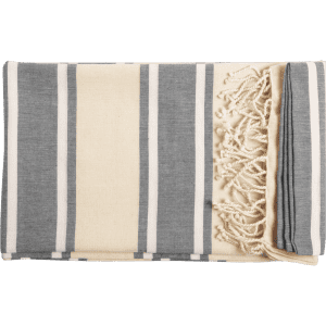 A striped towel pareo featuring grey and cream colours, with decorative fringes on one edge. Includes branding.