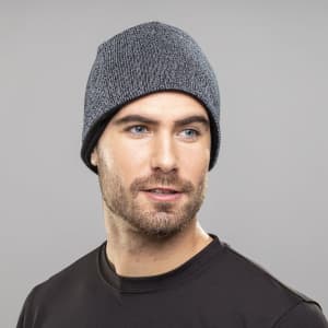 A grey Terban Hat is worn by a man with a beard, featuring a snug fit and a subtle textured design.