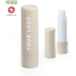 A lip balm in a natural bamboo fibre tube with a white cap, featuring a logo placeholder. The scent is vanilla.