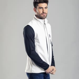 A white vest with a high collar, featuring a zip front and a logo, worn over a black long-sleeve top.