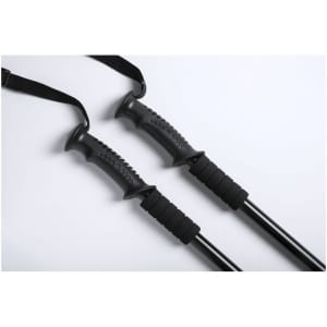 A set of black walking poles featuring textured grips and adjustable straps.