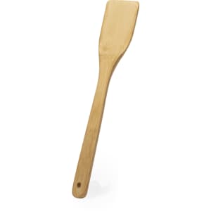 A bamboo spatula with a long handle and a flat, rectangular head. It has a circular hole for hanging.