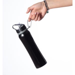 A black drink bottle with a silver carabiner held by a hand, showcasing its sleek design.