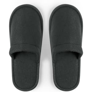 A pair of black Tarkun slippers with a soft fabric upper and flat soles. They feature a simple, minimalist design.
