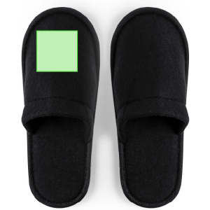 Black slippers with a simple design and a textured surface, featuring a green square on one side.