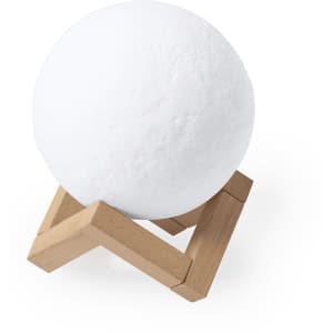 A white spherical speaker on a wooden stand, featuring a minimalist design and smooth surface.