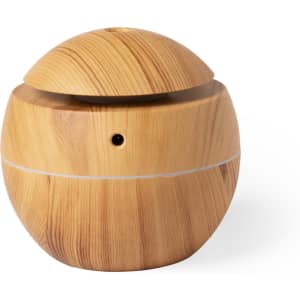 A round, wood-patterned humidifier with a sleek design. It features a removable lid and a small control button.