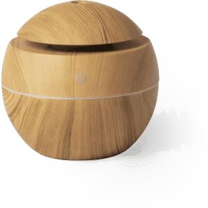 A round wooden humidifier in a light timber finish with a small power button on the front.