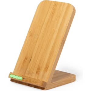 A bamboo wireless charger with a sleek design, featuring a logo and a green LED light at the base.