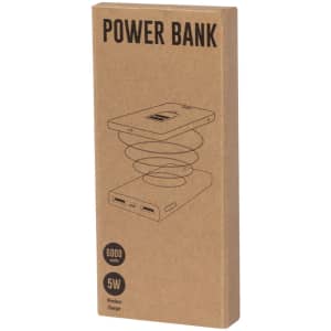 A power bank in brown packaging, featuring a wireless charger design and specifications for 6000 mAh capacity and 5W output.