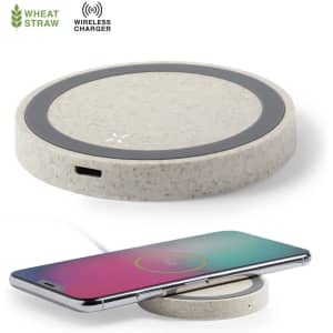 A wireless charger in a light beige colour with a circular design, featuring a logo and a smartphone placed on it.