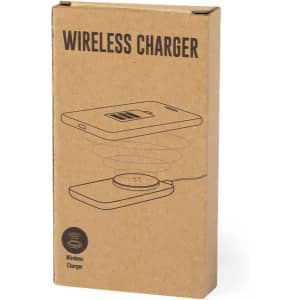 A brown cardboard box containing a wireless charger in a minimalist design with a logo on it.