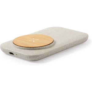 A wireless charger in grey with a wooden top, featuring a sleek, minimalistic design and a USB port.