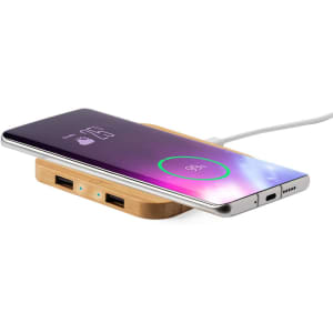 A wireless charger with a wooden base and a sleek, modern design, featuring a smartphone on top.