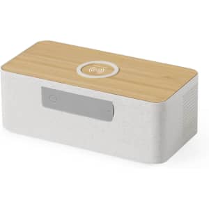 A rectangular wireless charger speaker in white with a wooden top and a grey control panel features a logo.